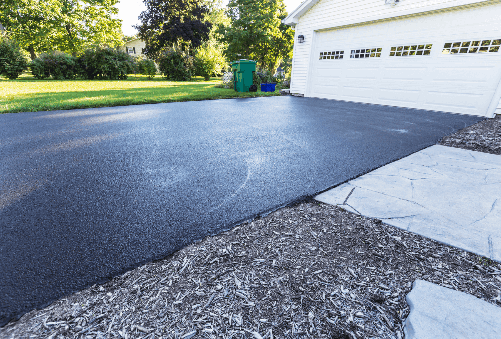 concrete driveway floor with a lawn