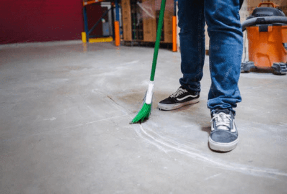sweeping out a cleaned out crack repair