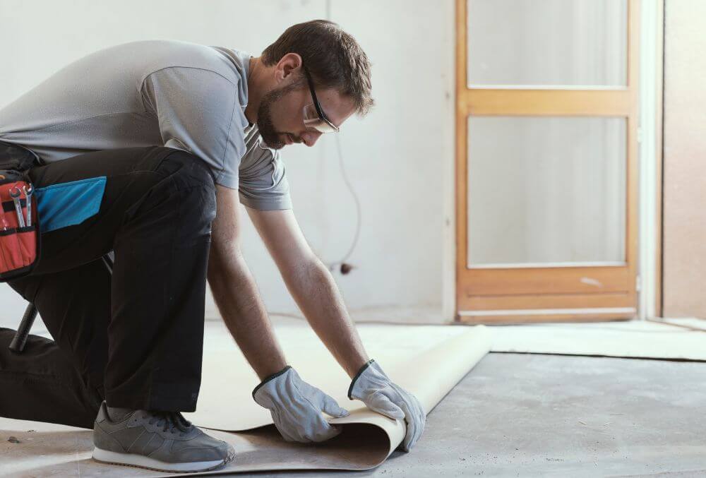concrete floor contractor with protective gloves
