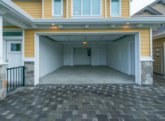 yellow house with garage floor