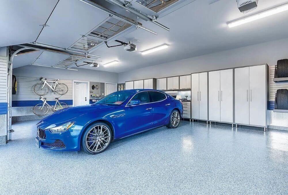 blue colored sports car inside the garage