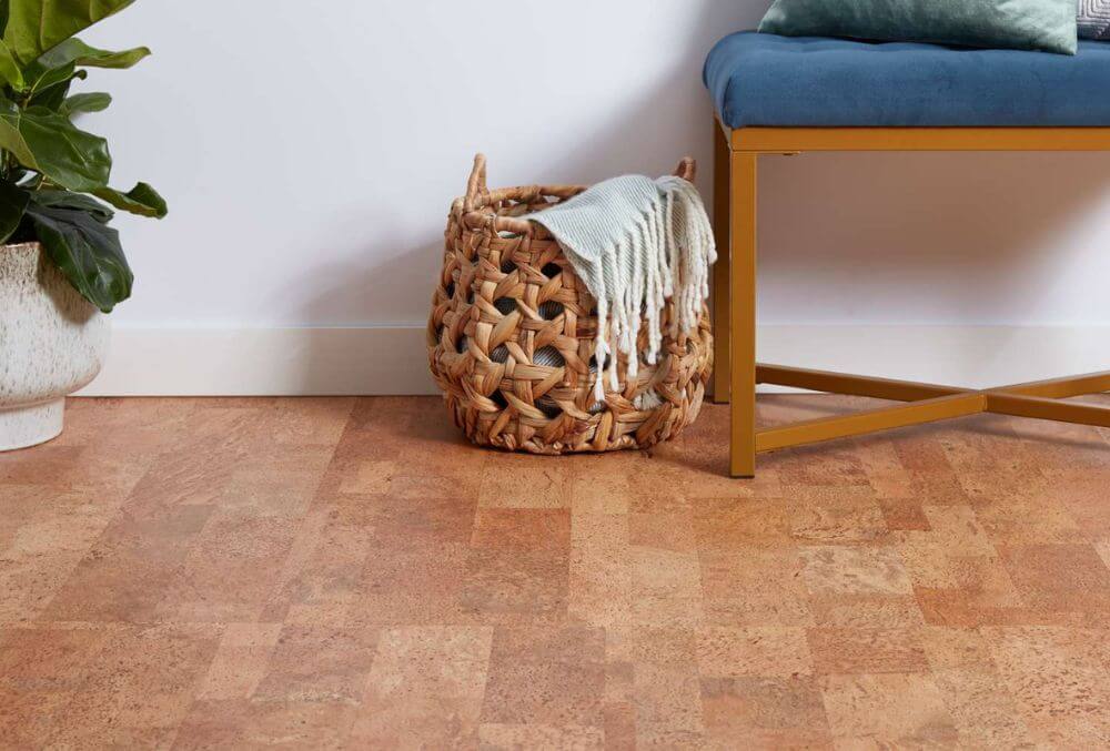 wood flooring with a weave basket and a plant