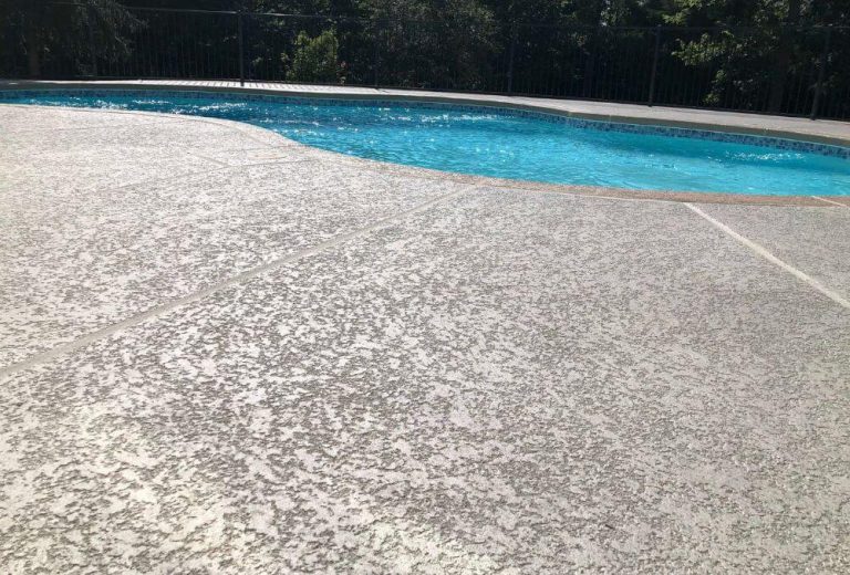 Concrete pool deck with classic textured finish for slip resistance and style