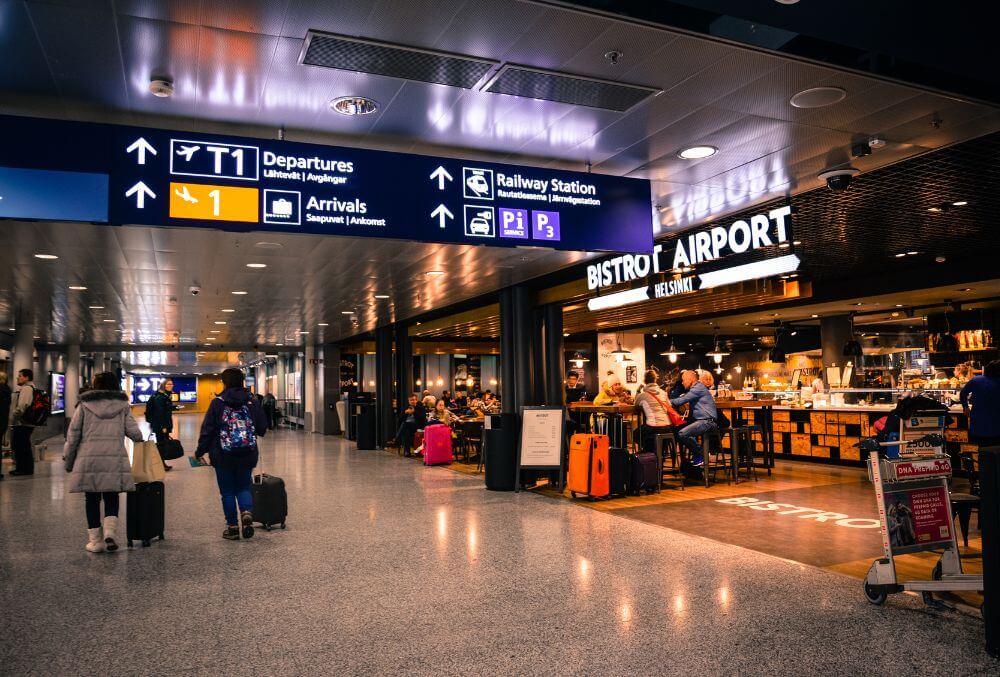 passengers on the airport, walking and sitting with their luggages