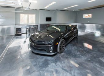polished garage floor with black luxury car