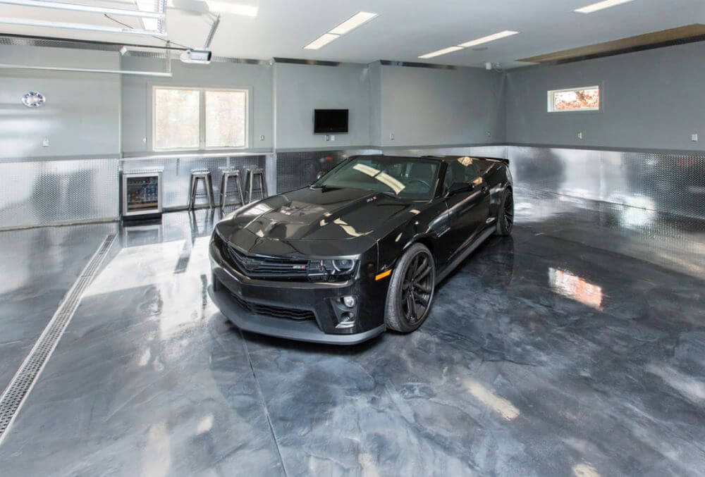 polished garage floor with black luxury car