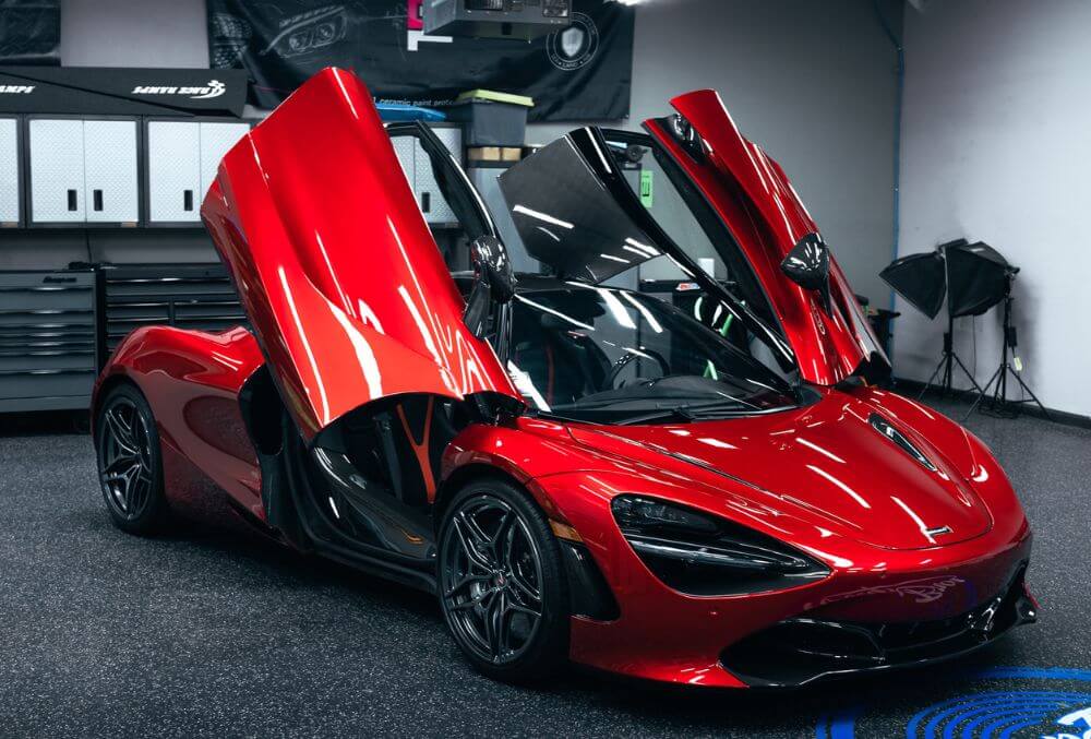 red sports car inside the garage