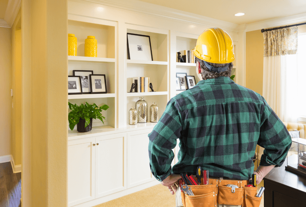 contractor looking at the living room area