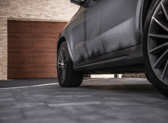 black car in the driveway