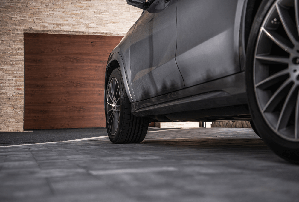 black car in the driveway