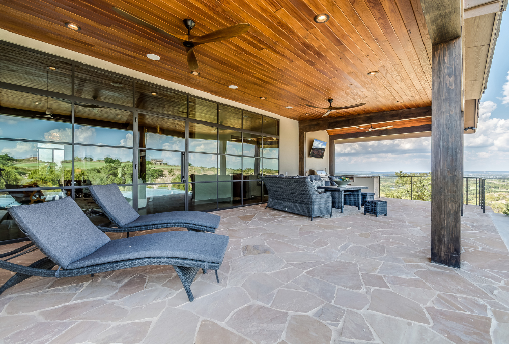 stamped concrete patio with outdoor chairs
