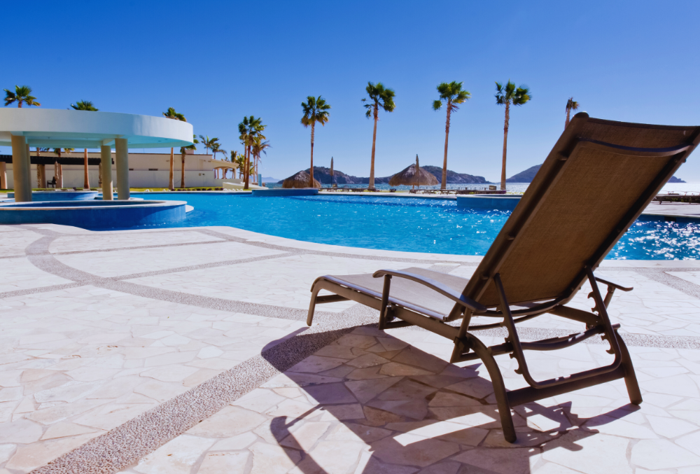 concrete pool deck with chair