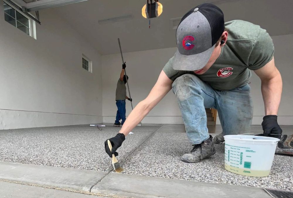 contractor applying coating on a garage