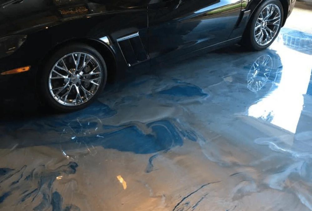 black car parked in a epoxy coated garage floor