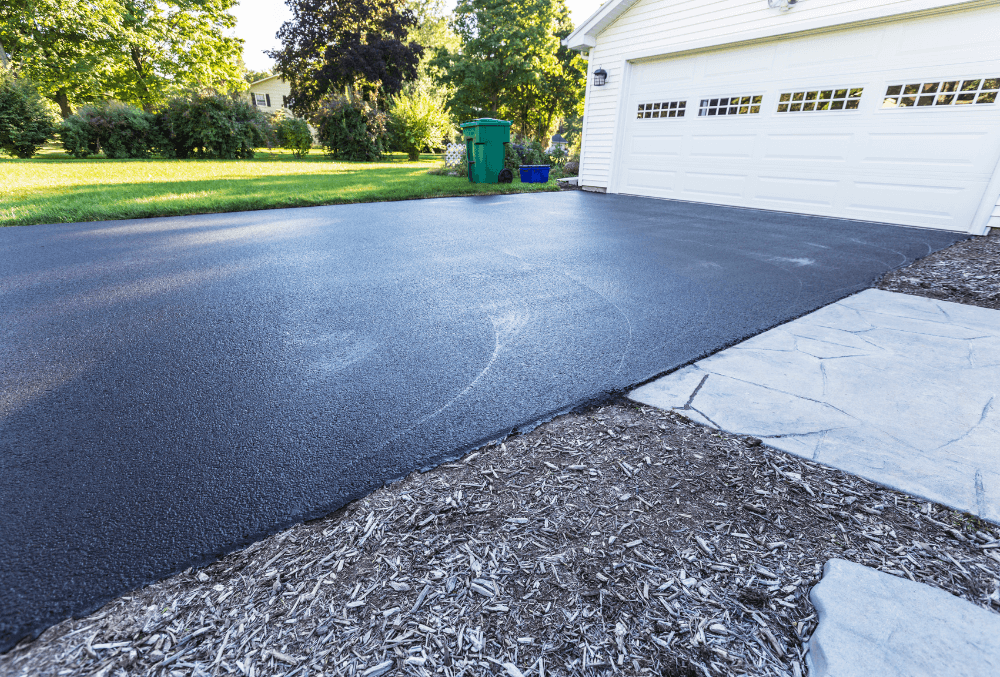 concrete driveway floor with a lawn